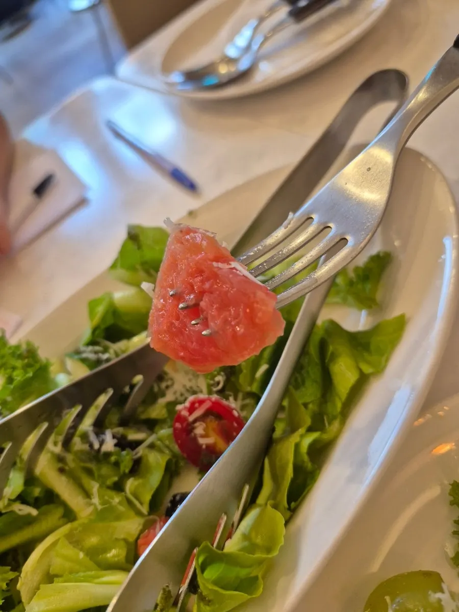 Fruit salad generously topped with cheese