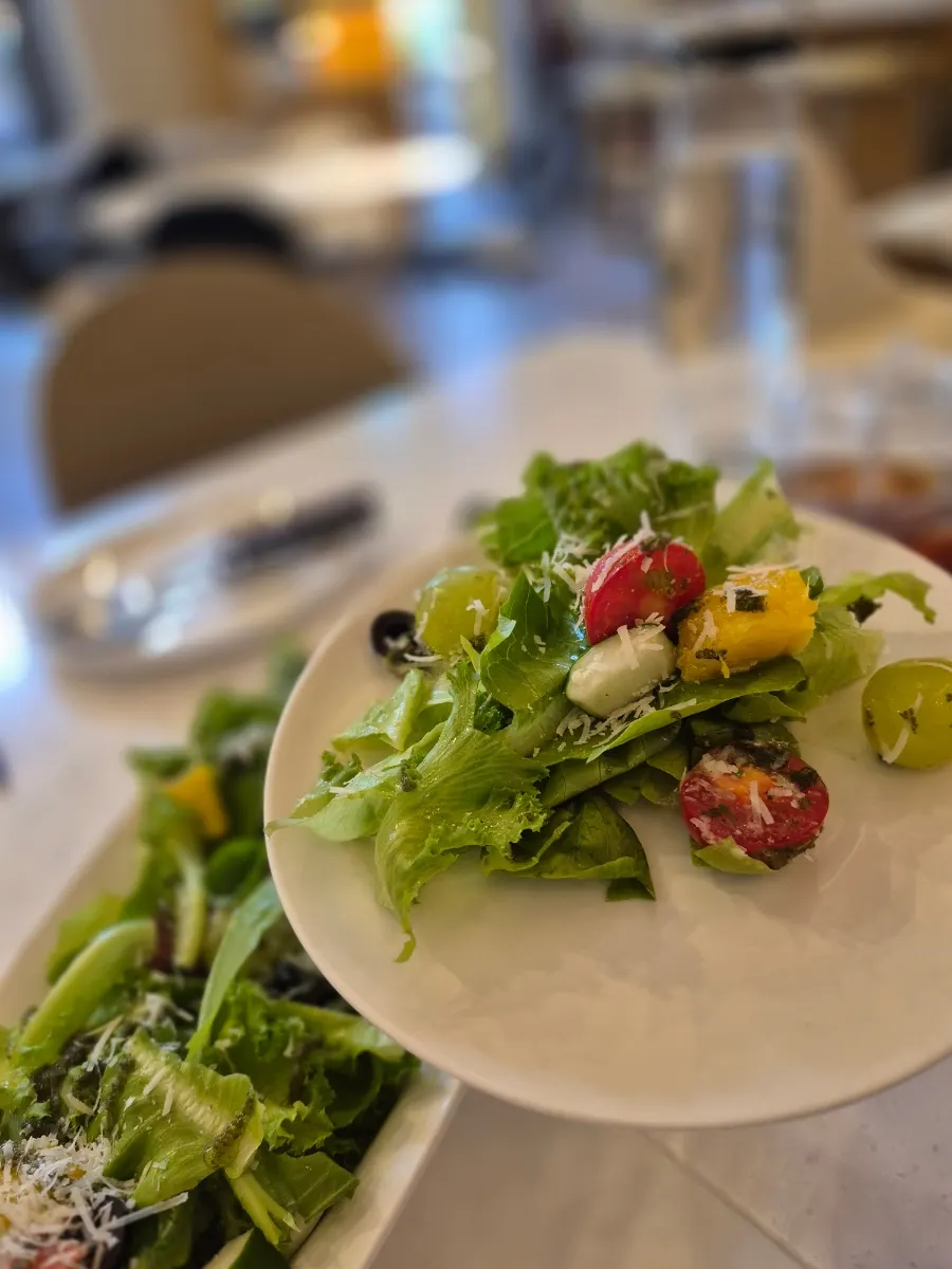 A forkful scooped from the garden fruit salad