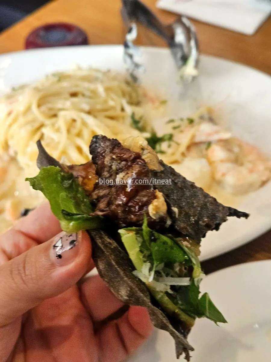 Close-up of plump shrimp on the cream pasta