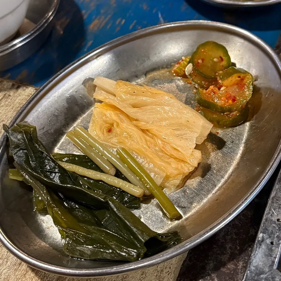 A golden-brown grilled piece of yukgyeopsal