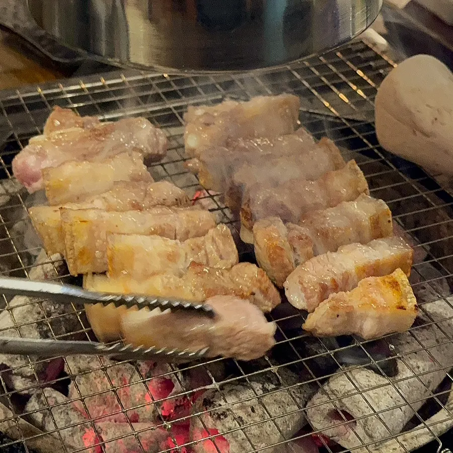 Yukgyeopsal and bibim naengmyeon served together at the end of the meal