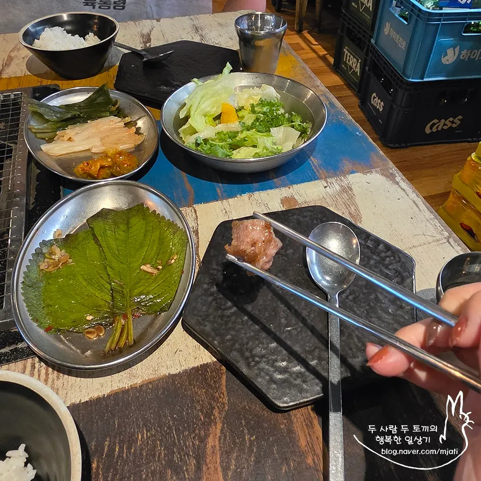Staff trimming the pork belly with scissors