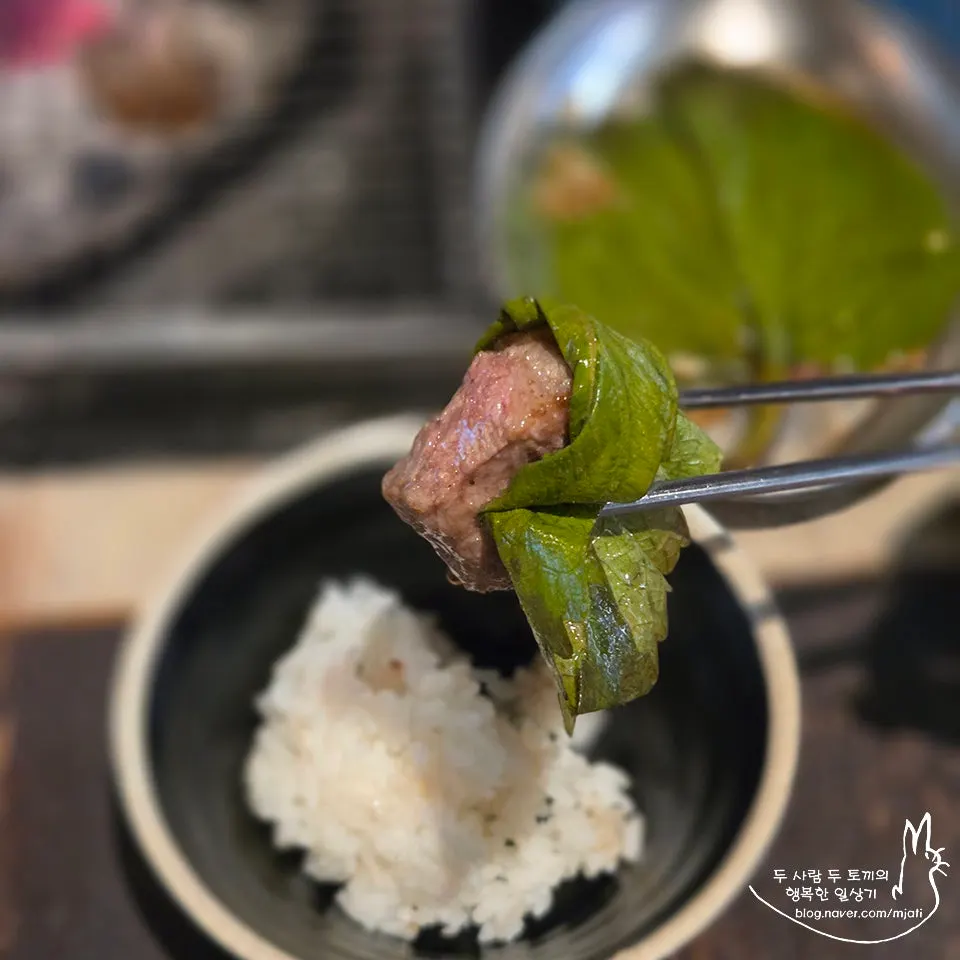 A bite of pork belly paired with side dishes