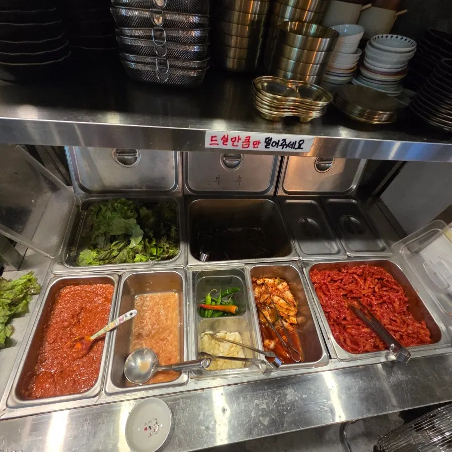 Plate of chive salad and other side dishes
