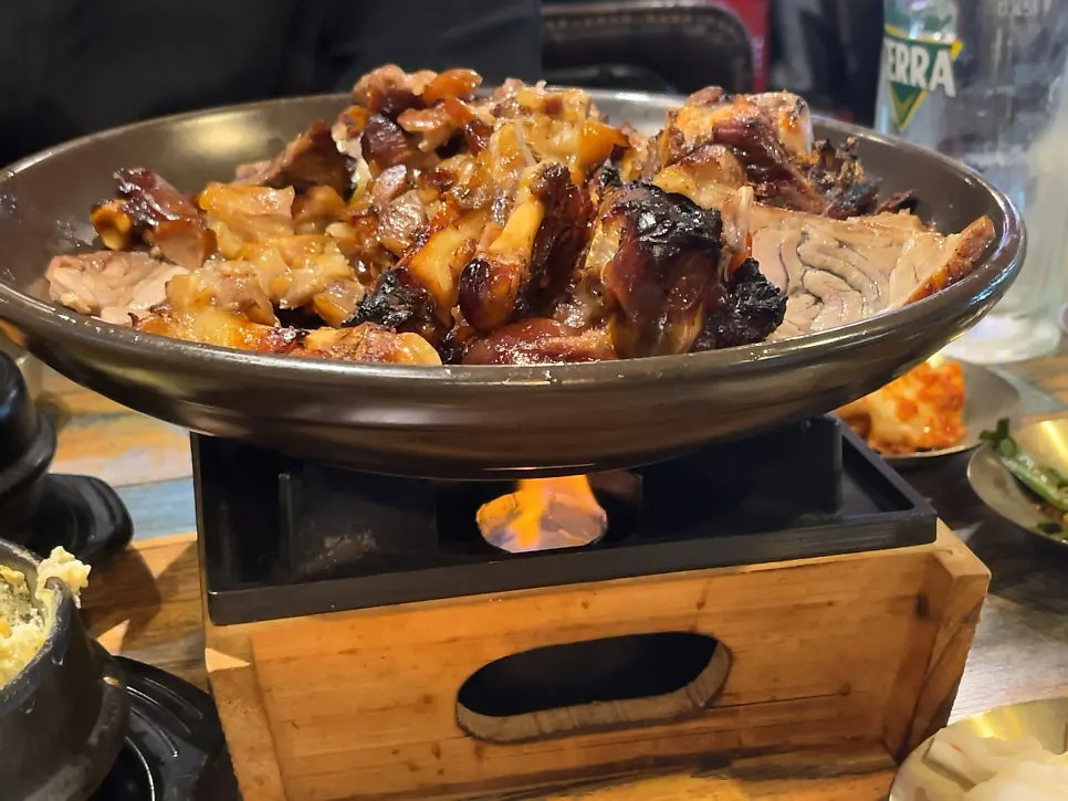 Whole-leg jokbal platter with a lit candle underneath