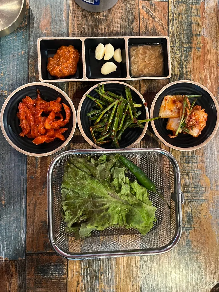 Basic side dish spread of ssamjang, garlic, and salted shrimp