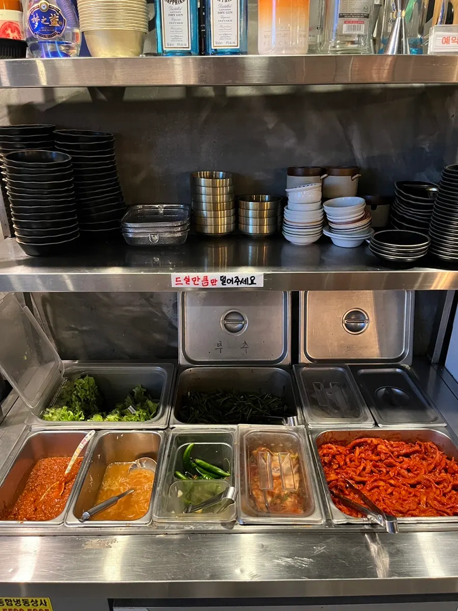 Radish kimchi, cabbage kimchi, and chive salad side dishes