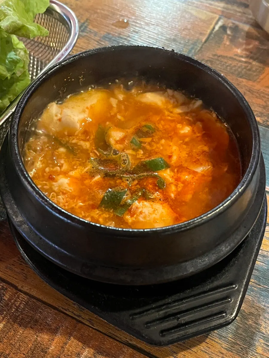 Complimentary sundubu-jjigae (soft tofu stew)