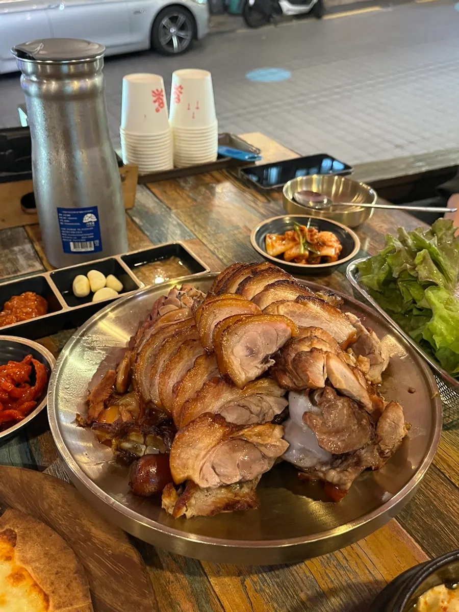 Close-up of the glistening wood-fired jokbal skin