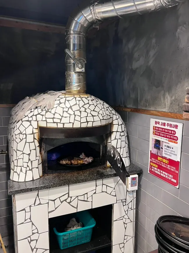 Half wood-fired jokbal, half bossam, and side dishes