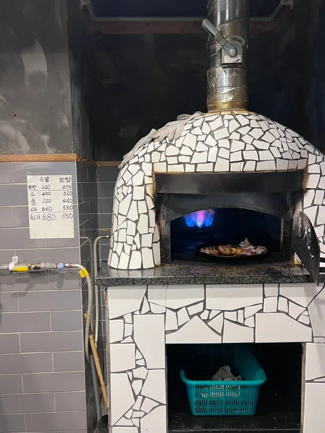 Half wood-fired jokbal, half bossam, and side dishes