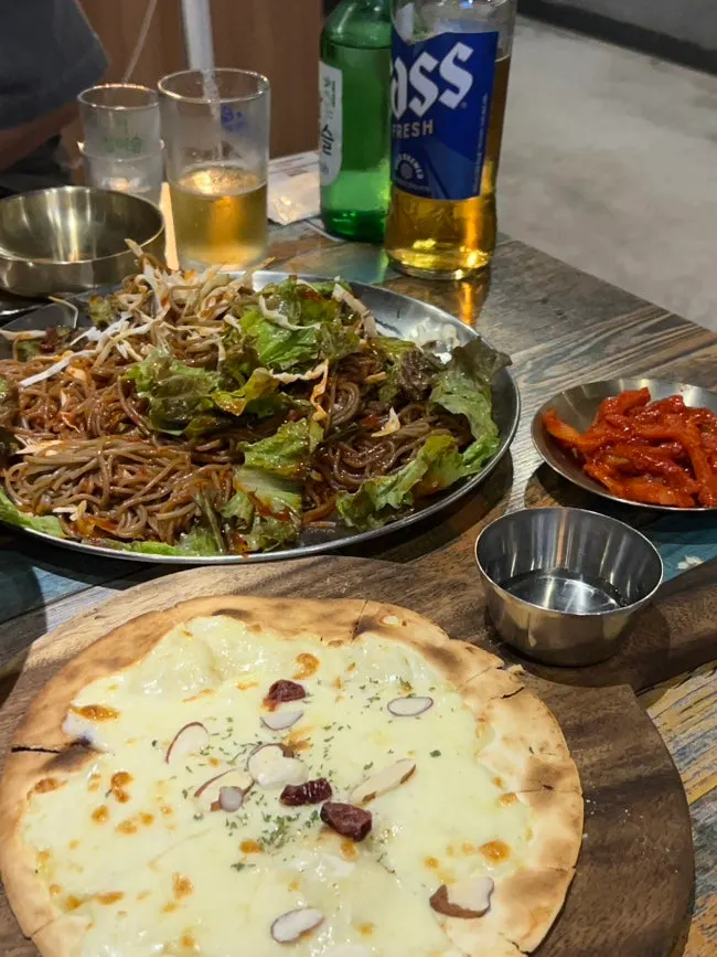 A piece of wood-fired jokbal with accompaniments
