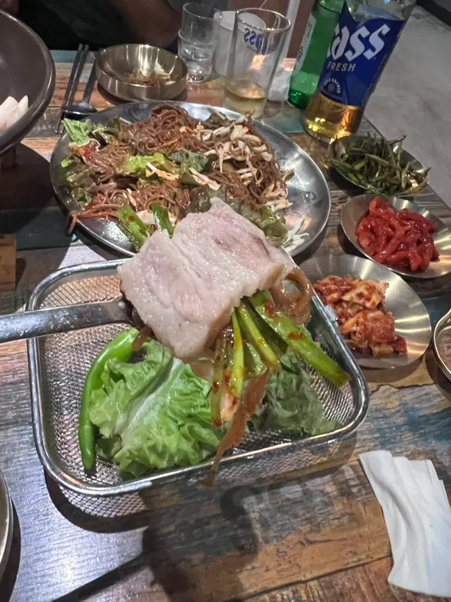 Wood-fired jokbal and side dish spread