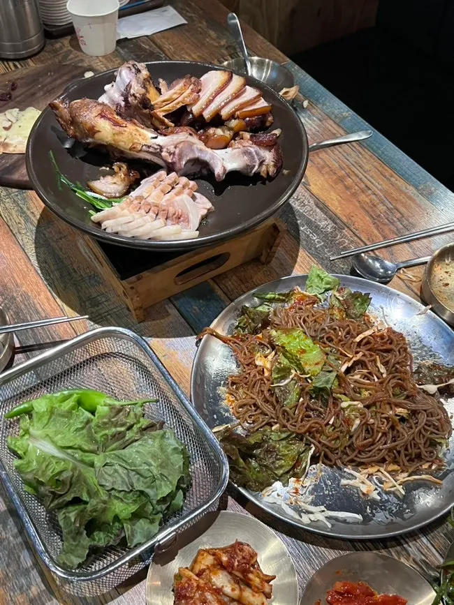 Myeongil Station wood-fired jokbal meal spread