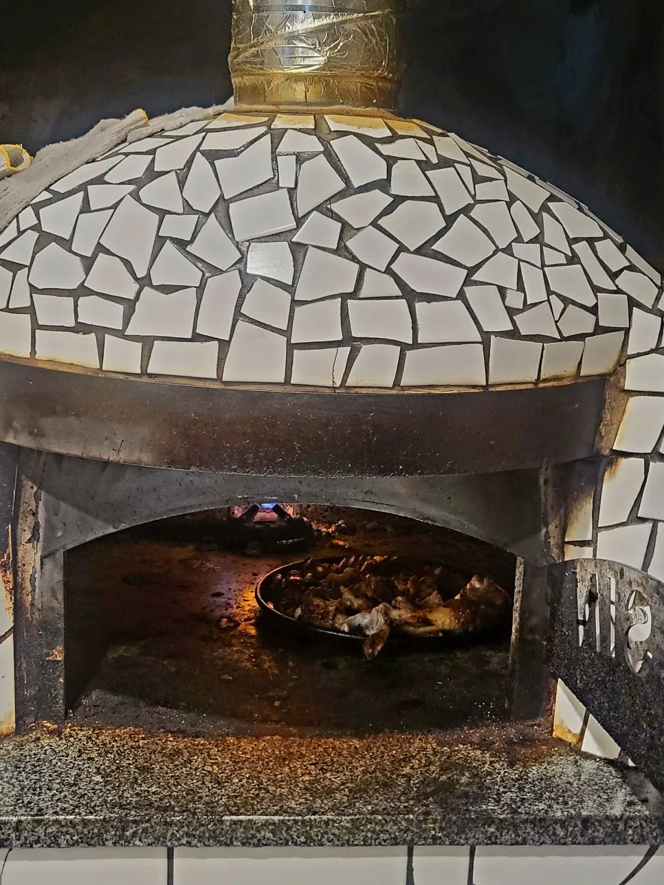 Jokbal roasting inside the wood oven at the back of the restaurant