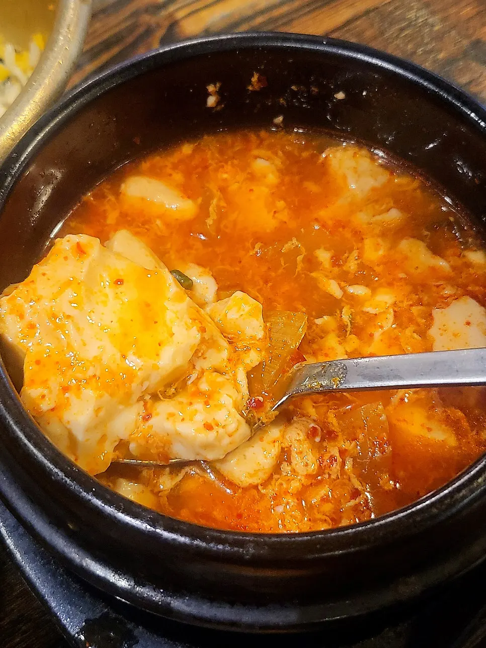 Close-up of sundubu jjigae with beaten egg