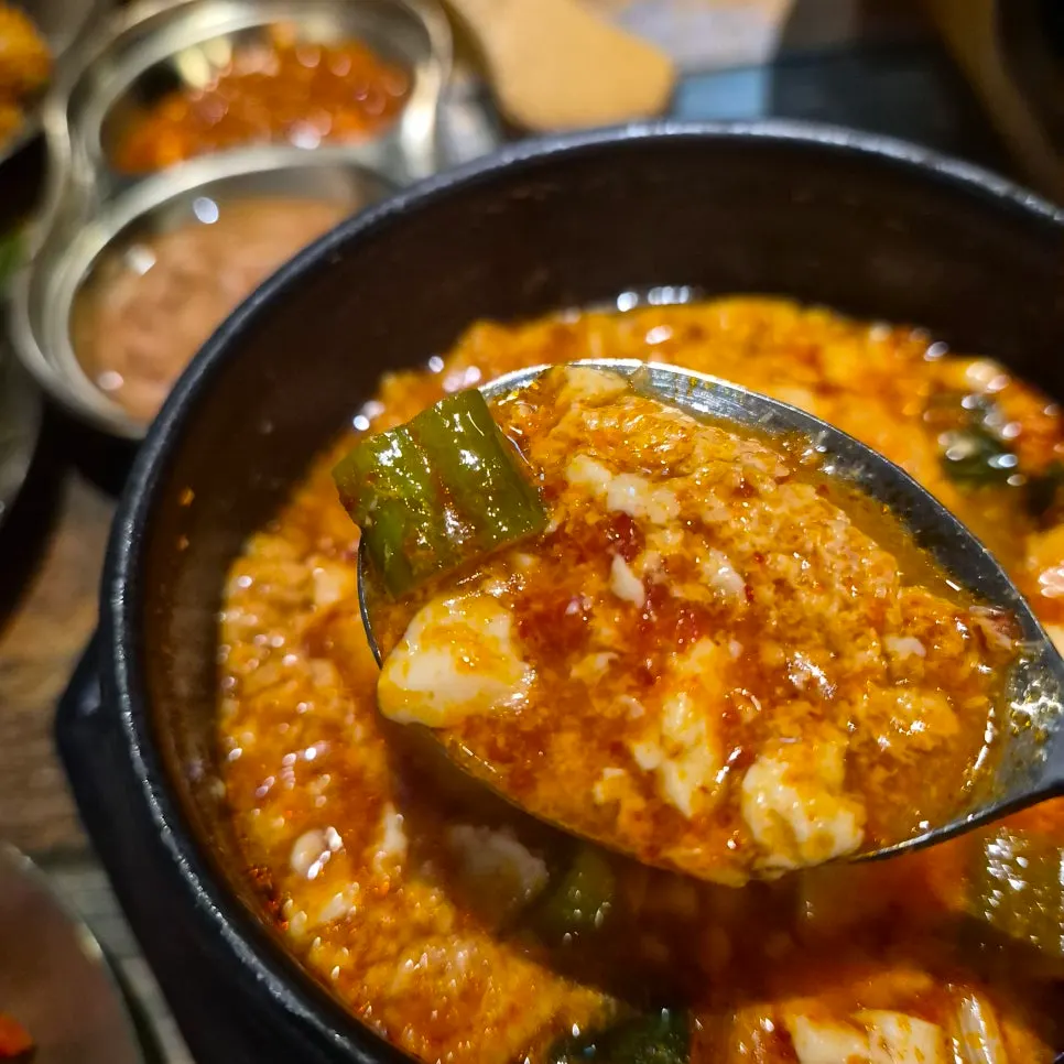 Warm sundubu-jjigae served alongside the meal