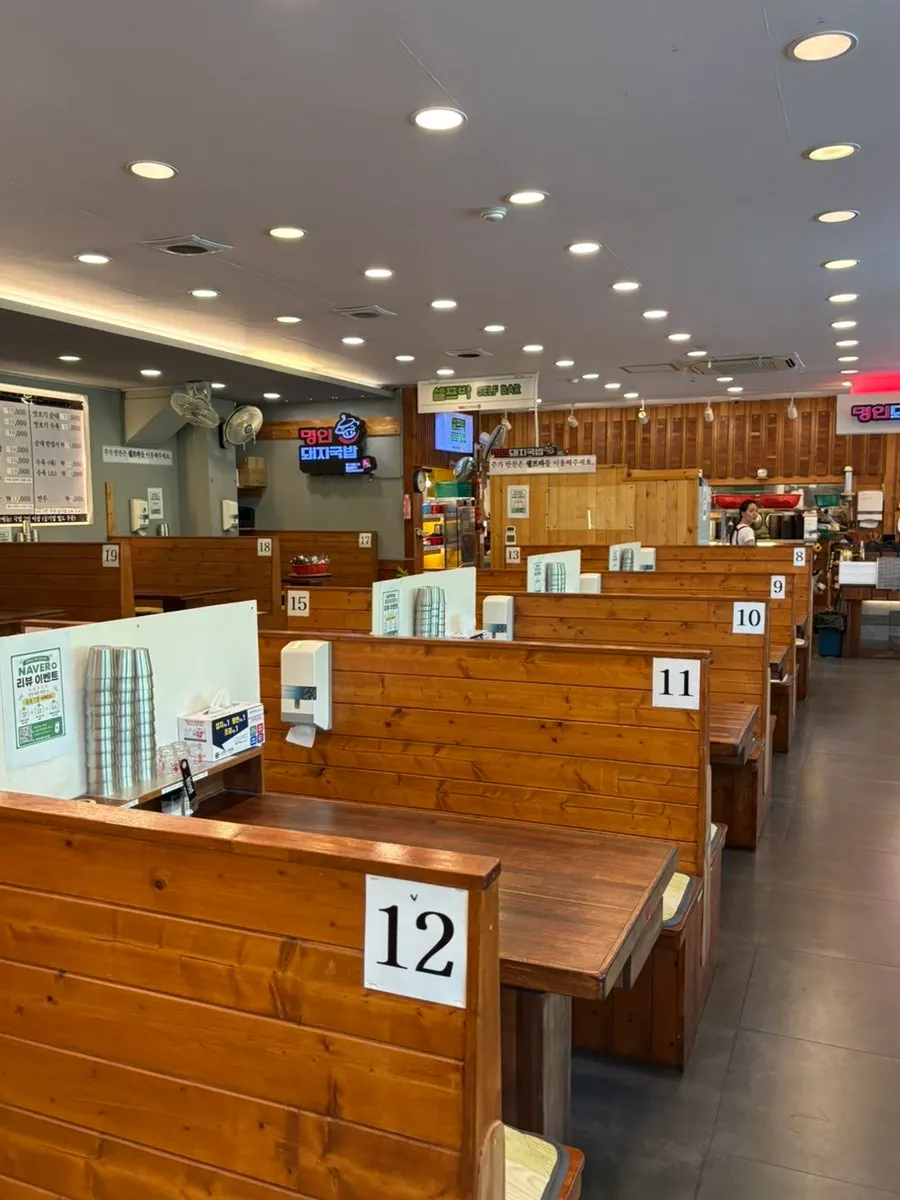 Neatly arranged table at Myeongin Dwaeji Gukbap