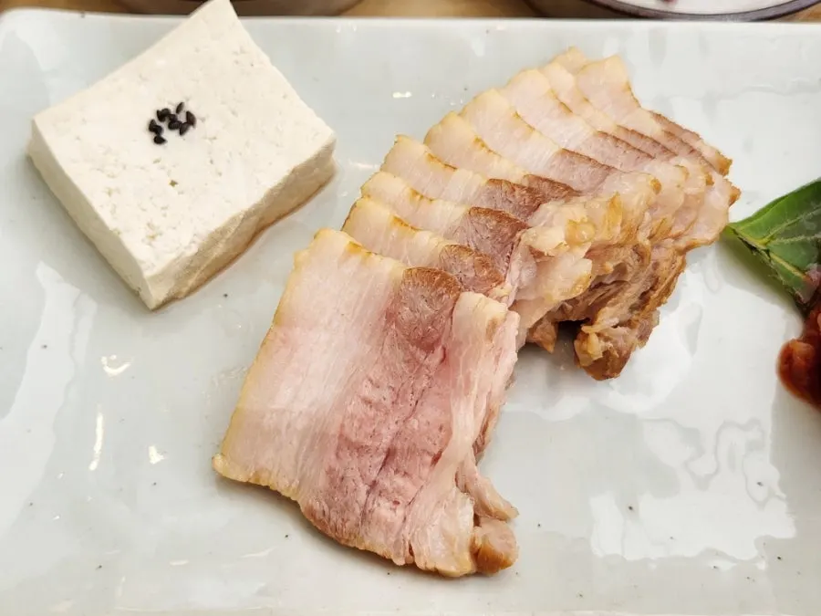 Boiled pork bossam with sweet-and-tangy radish kimchi