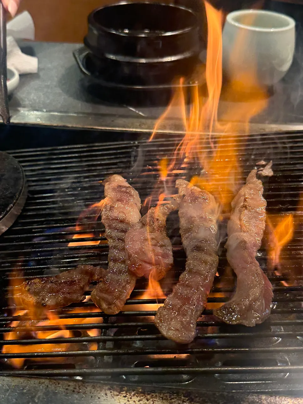 Rib finger meat placed over the corn fire