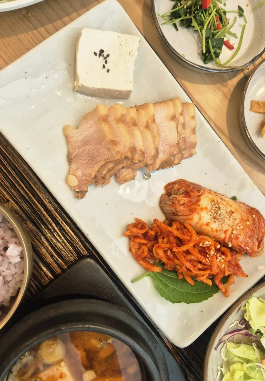 Table set with bossam kimchi and banchan