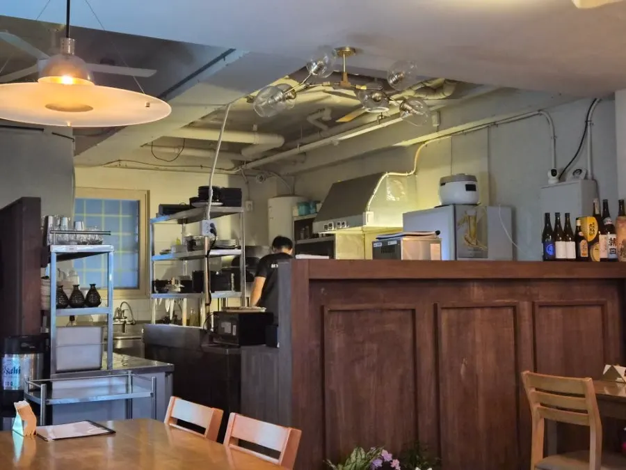 Open kitchen where cooking is visible