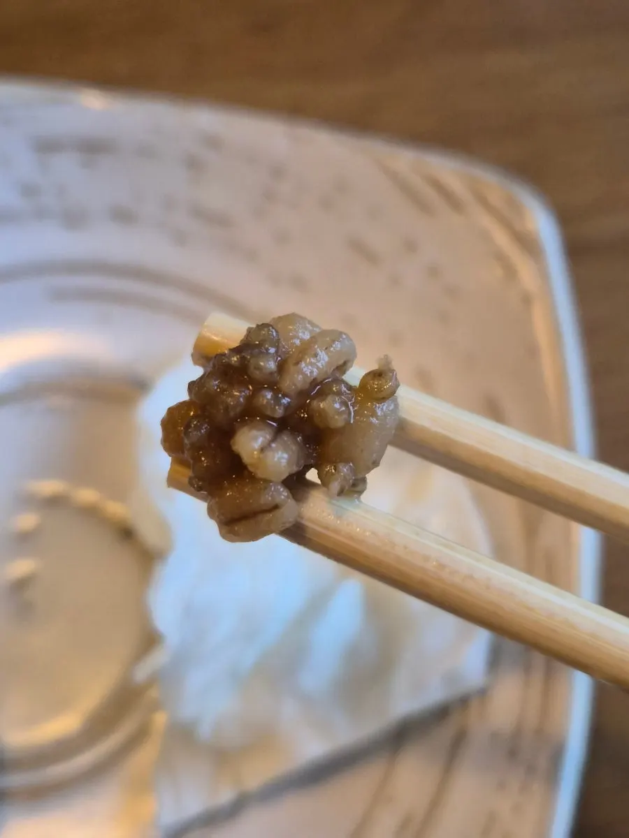 Barley doenjang spooned onto cabbage