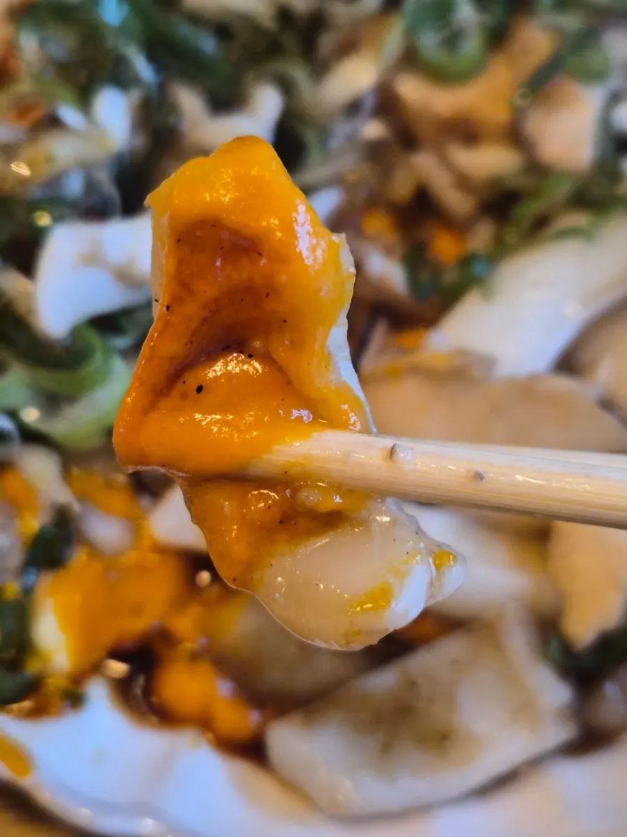 Grilled cuttlefish topped with carrot puree and scallion