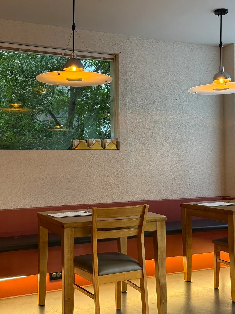 Interior mood with green leaves outside the window and red lighting