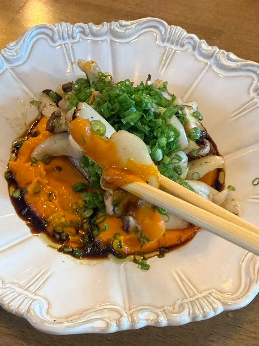 Close-up of grilled cuttlefish drizzled with tare sauce