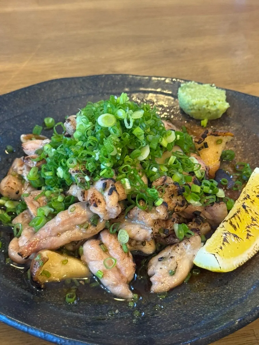 Plate of grilled cuttlefish with carrot sauce