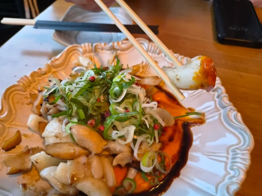Grilled cuttlefish plate with carrot puree underneath