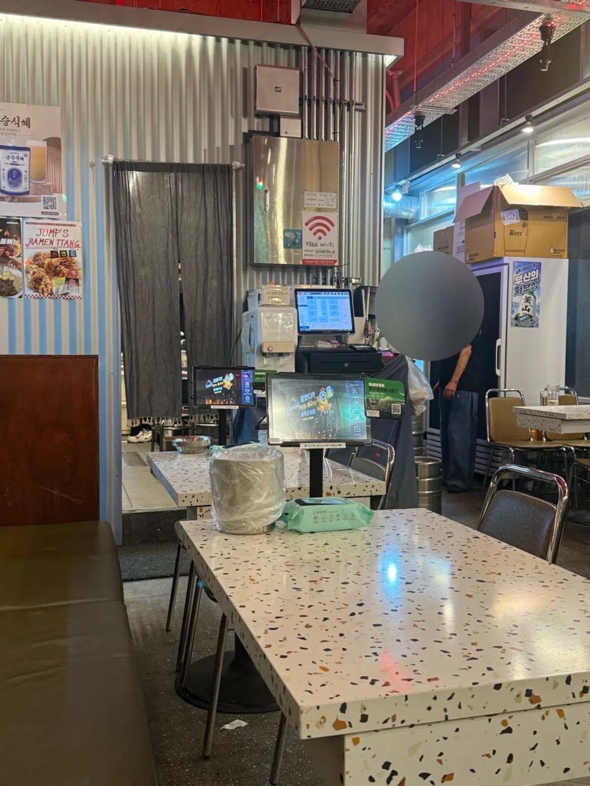 Electric rotisserie chicken machine at the entrance