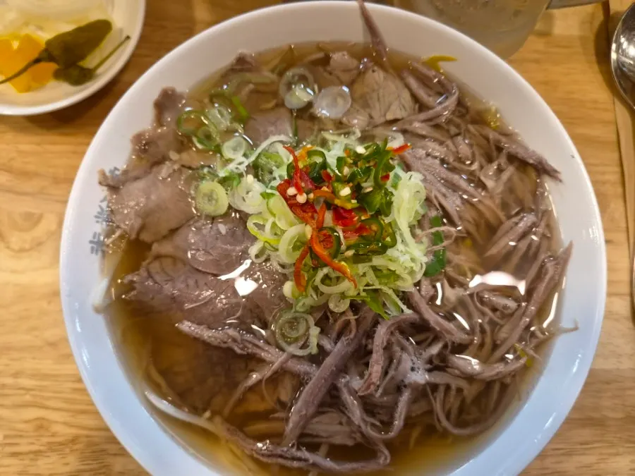 Beef belly and brisket pho with a drink