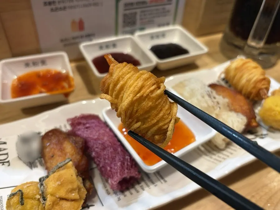 Crispy side dishes included in the fried appetizer platter