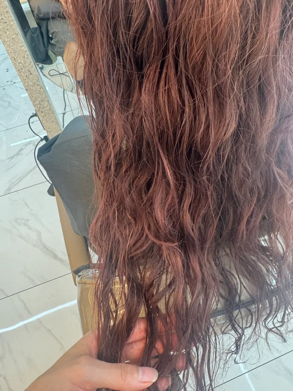 Purple-red hair color that changes with the light
