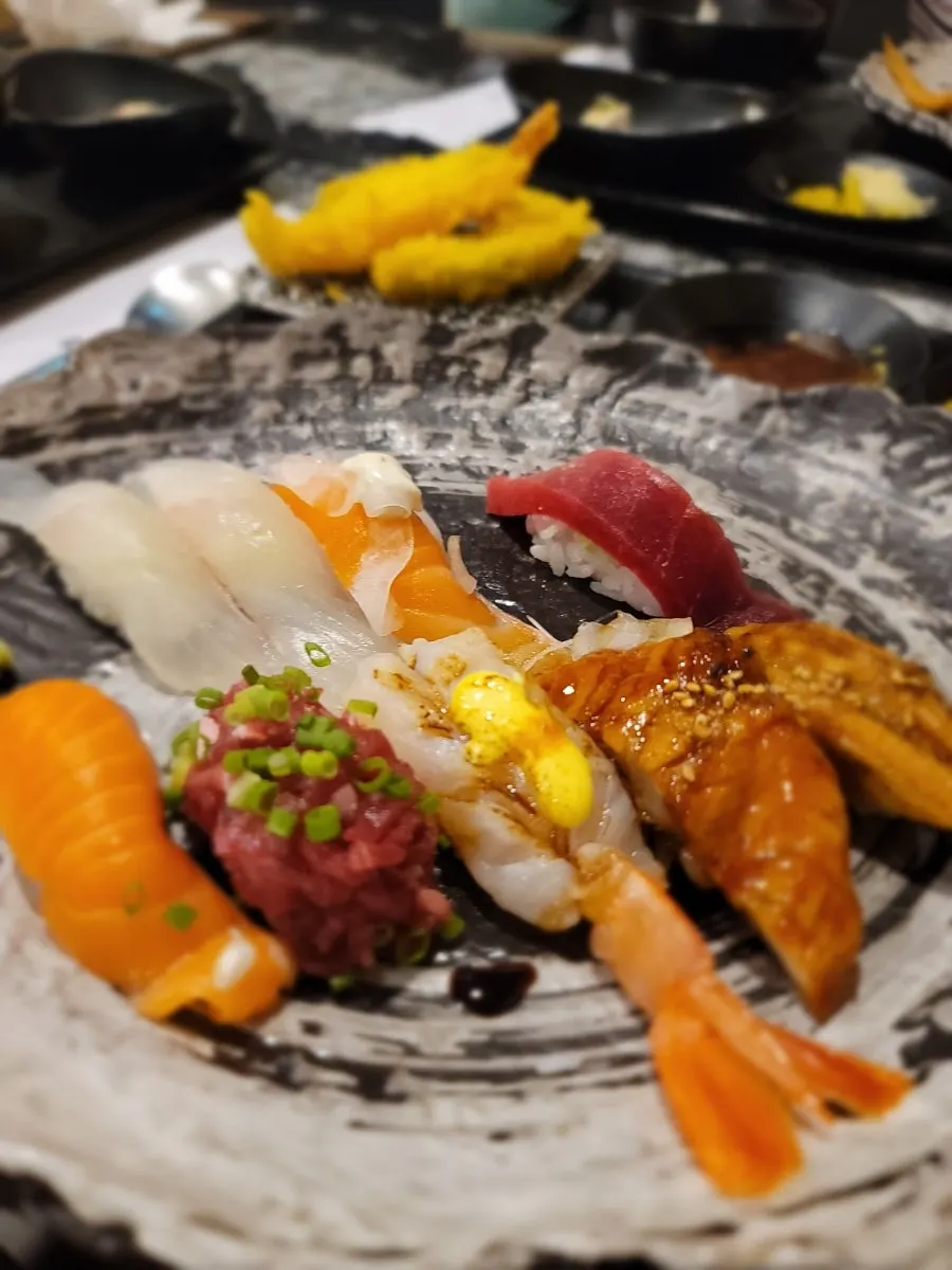 Chewy salmon sushi and beef tartare sushi