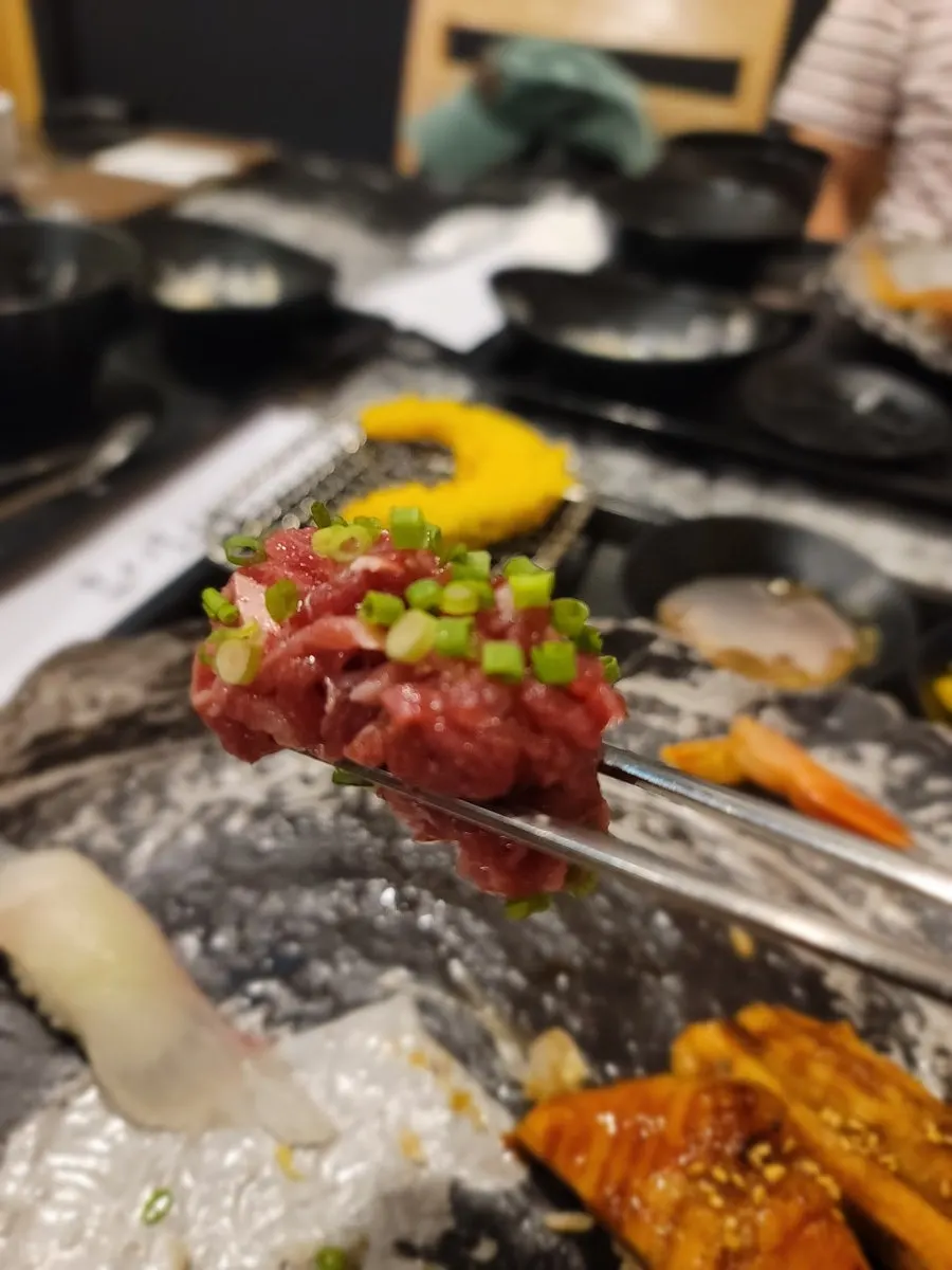 A generous portion of beef tartare sushi