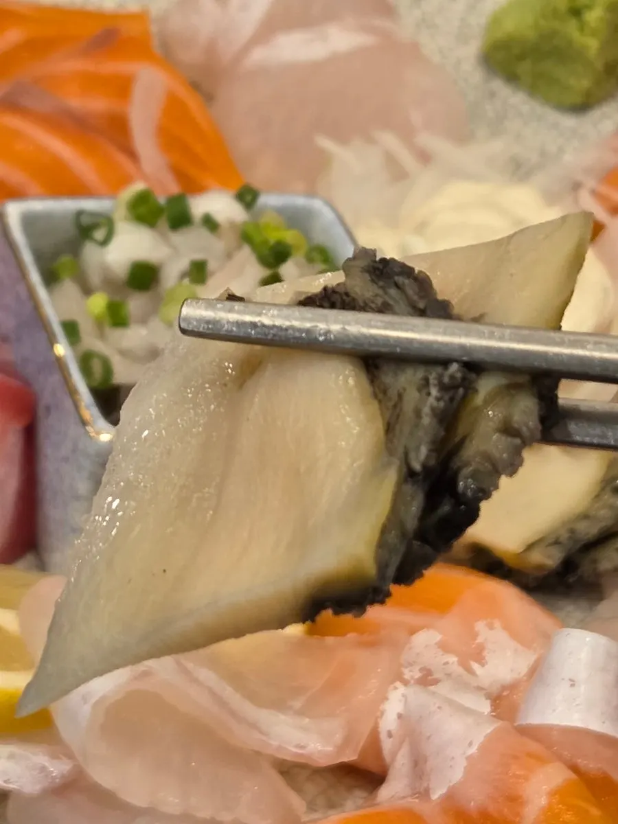 Crunchy abalone sashimi on top of the platter