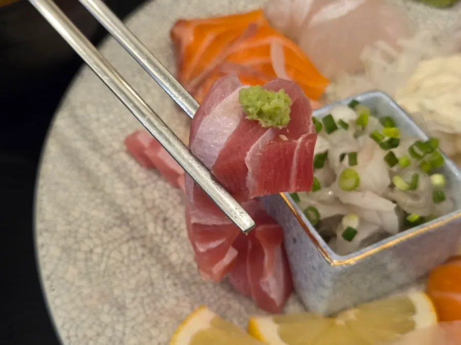 A thick-cut piece of sashimi