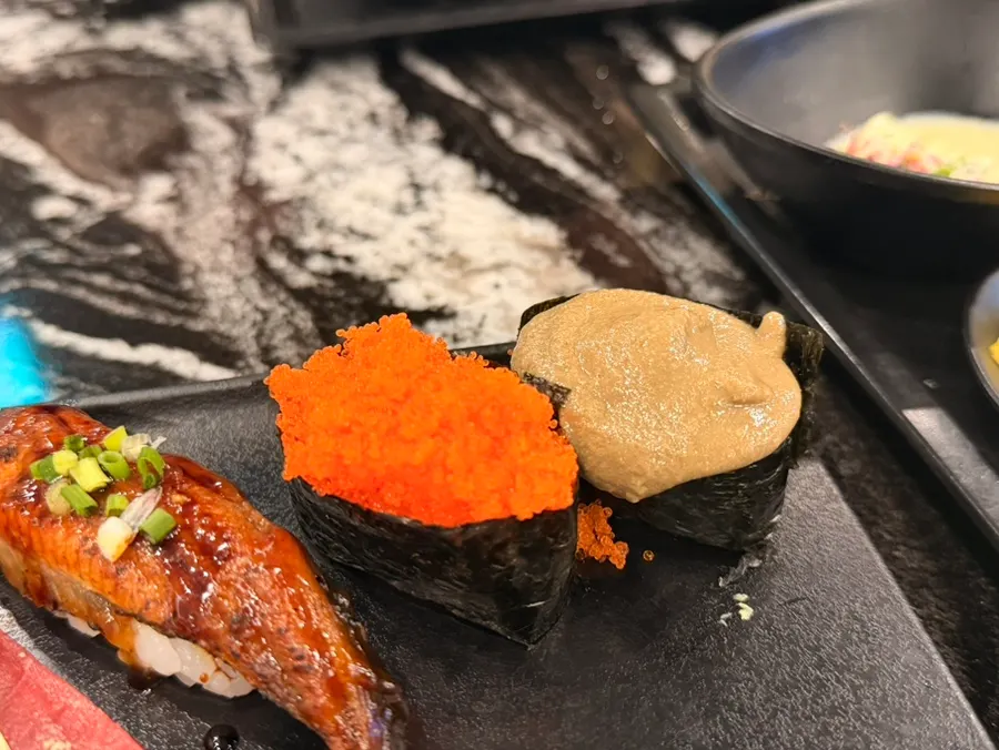 Flying fish roe gunkan and kani miso gunkan sushi