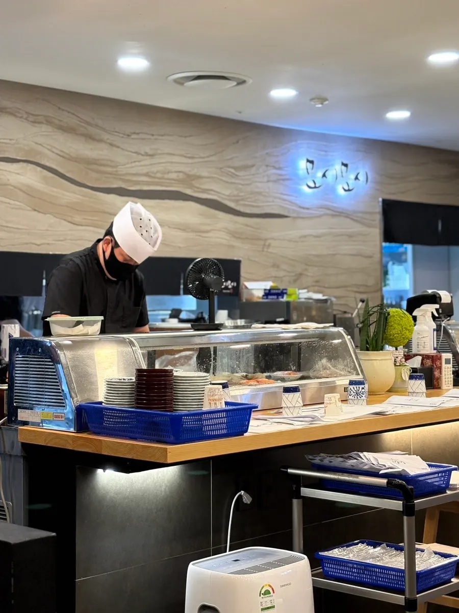 View of the sushi preparation area from the bar seats