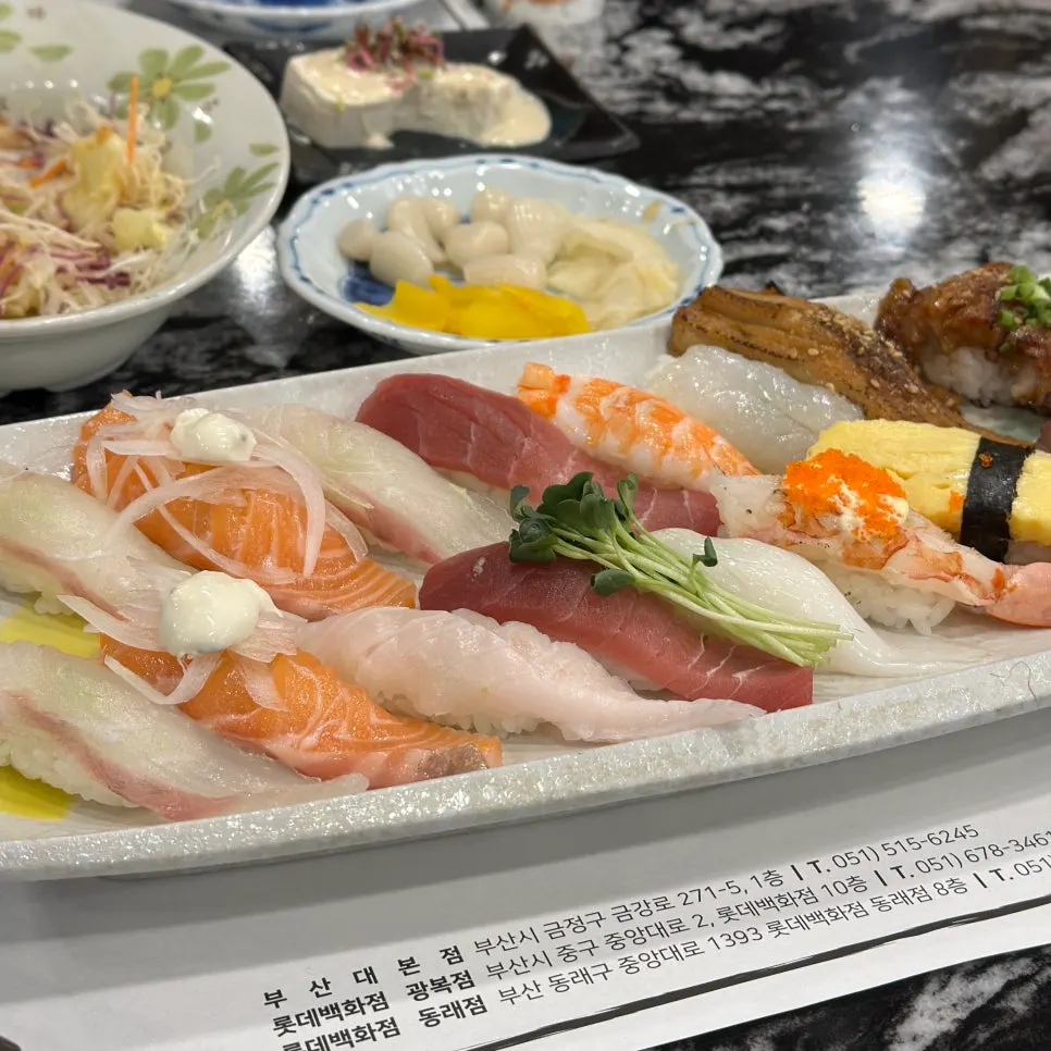 A full spread of sashimi and sushi from Set 1