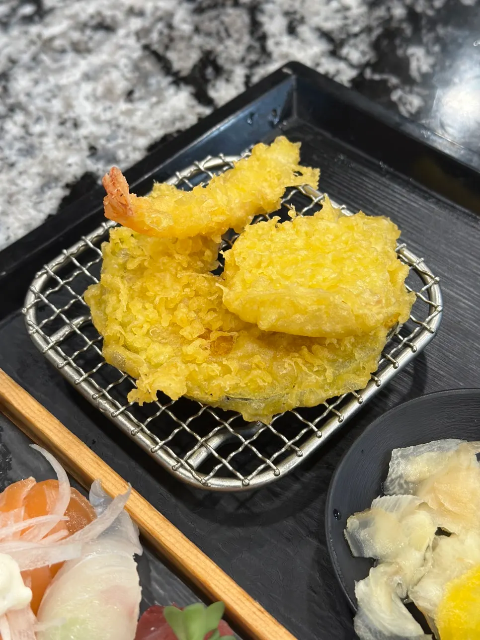 Assorted Sushi B arranged on a black tray