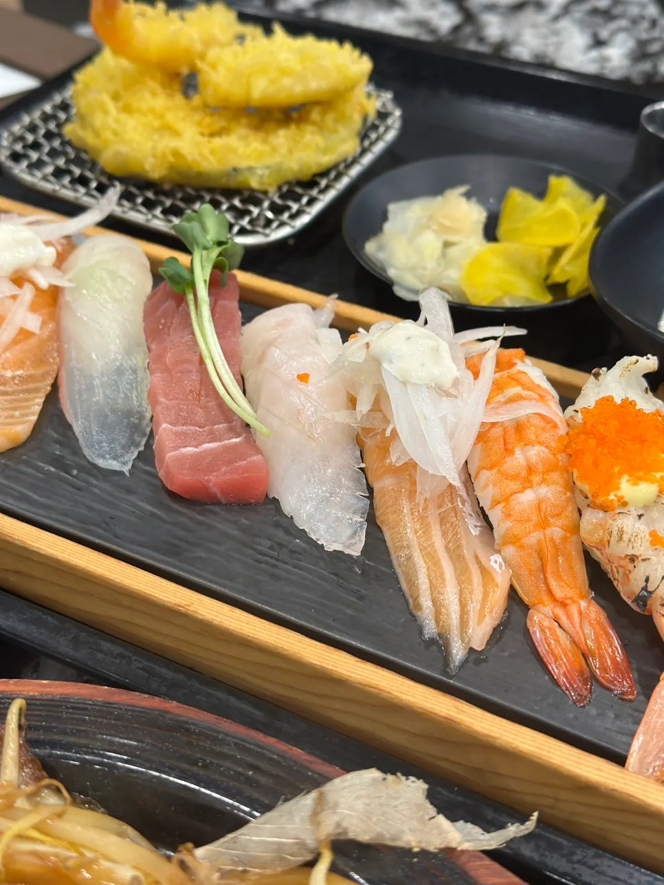 Shrimp, sweet potato, and pumpkin tempura served with the assorted sushi