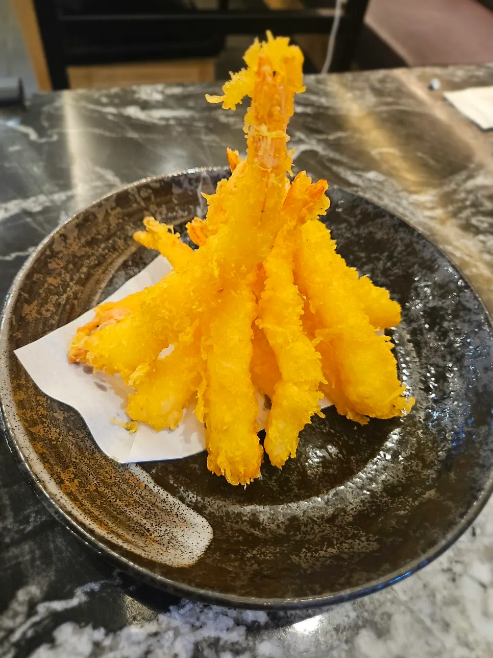 Nine pieces of shrimp tempura included in the set