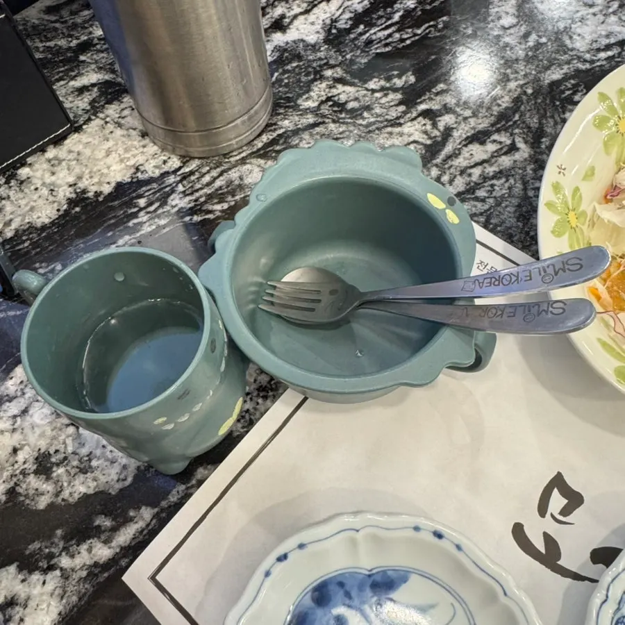 Soy sauce and small plates set on the table