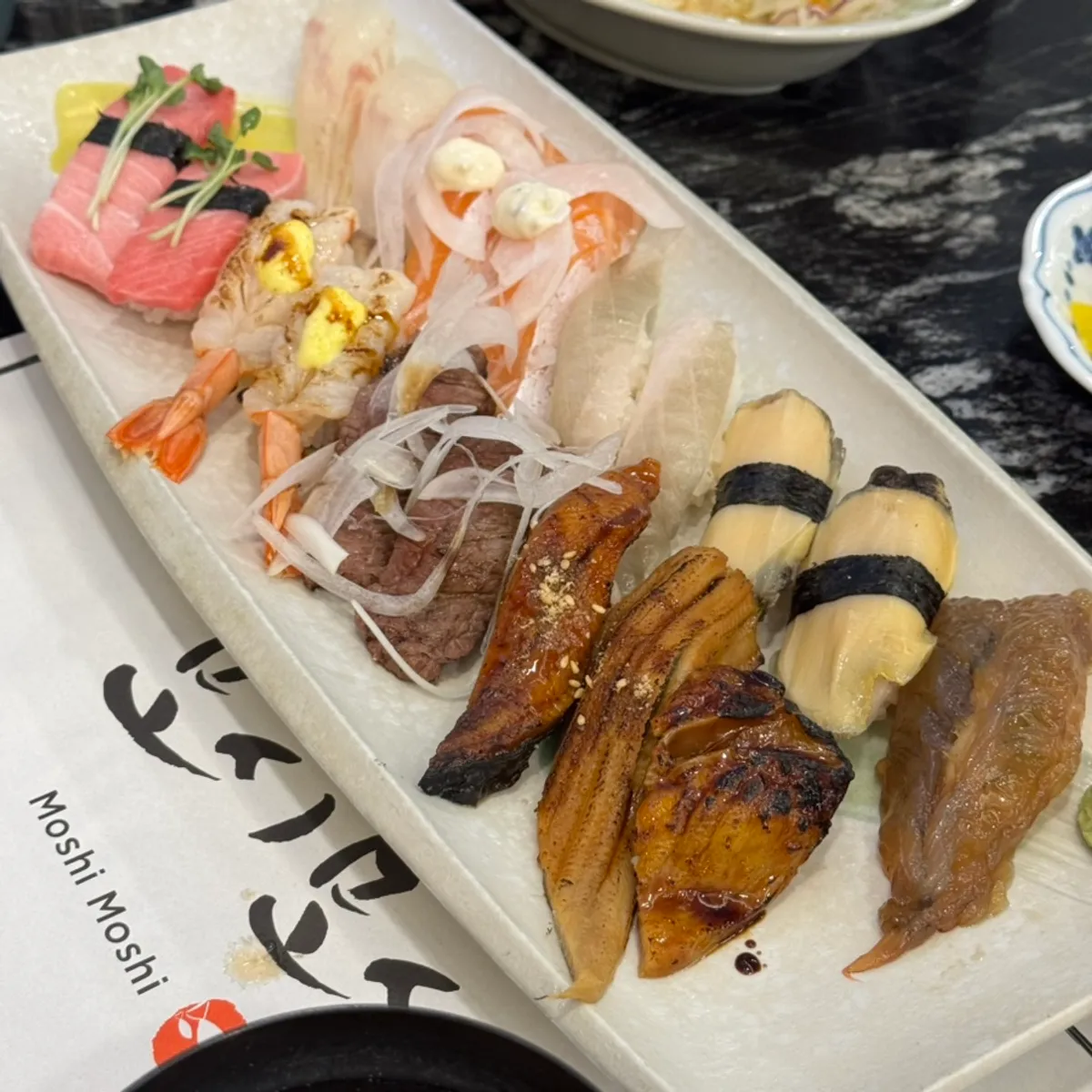 Plate of 18-piece sushi served in matching pairs