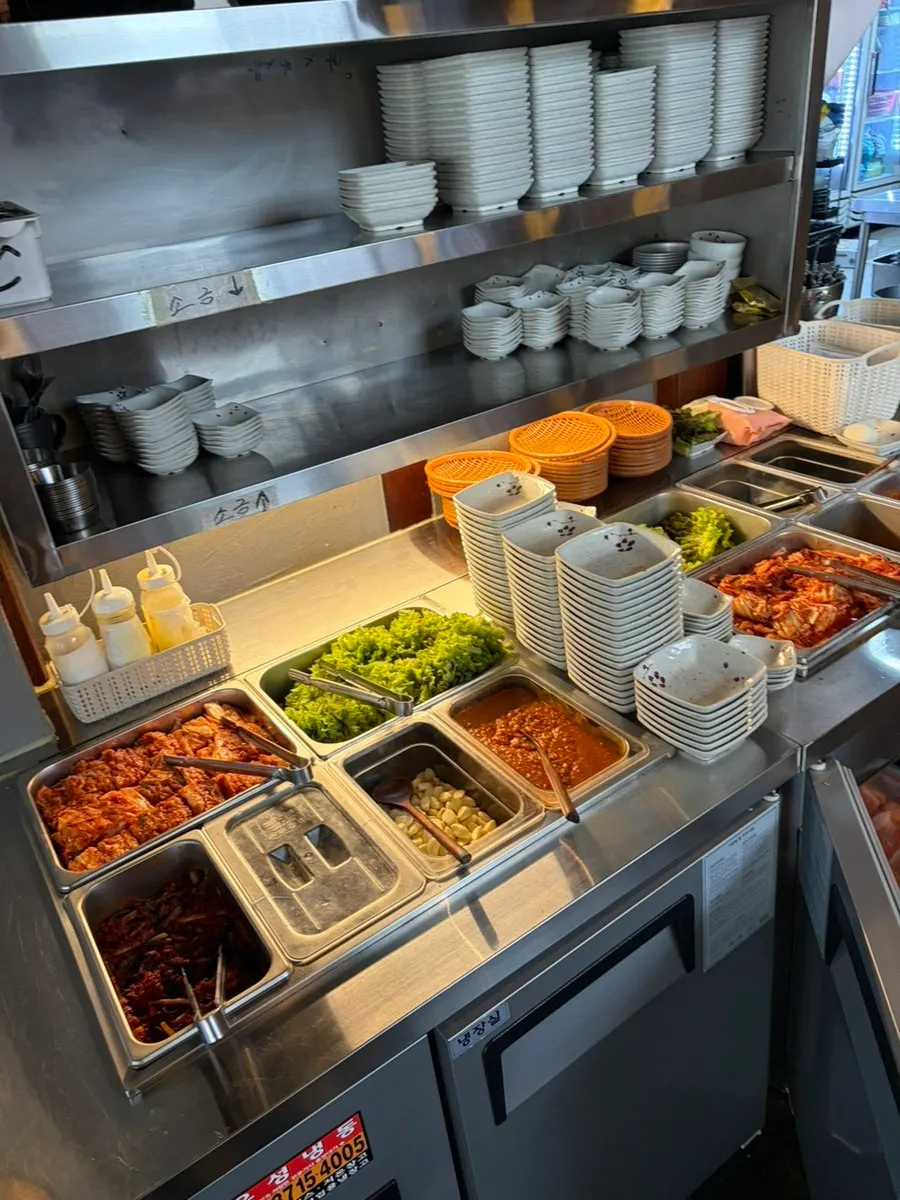 Self-serve side dish corner with salt and various banchan