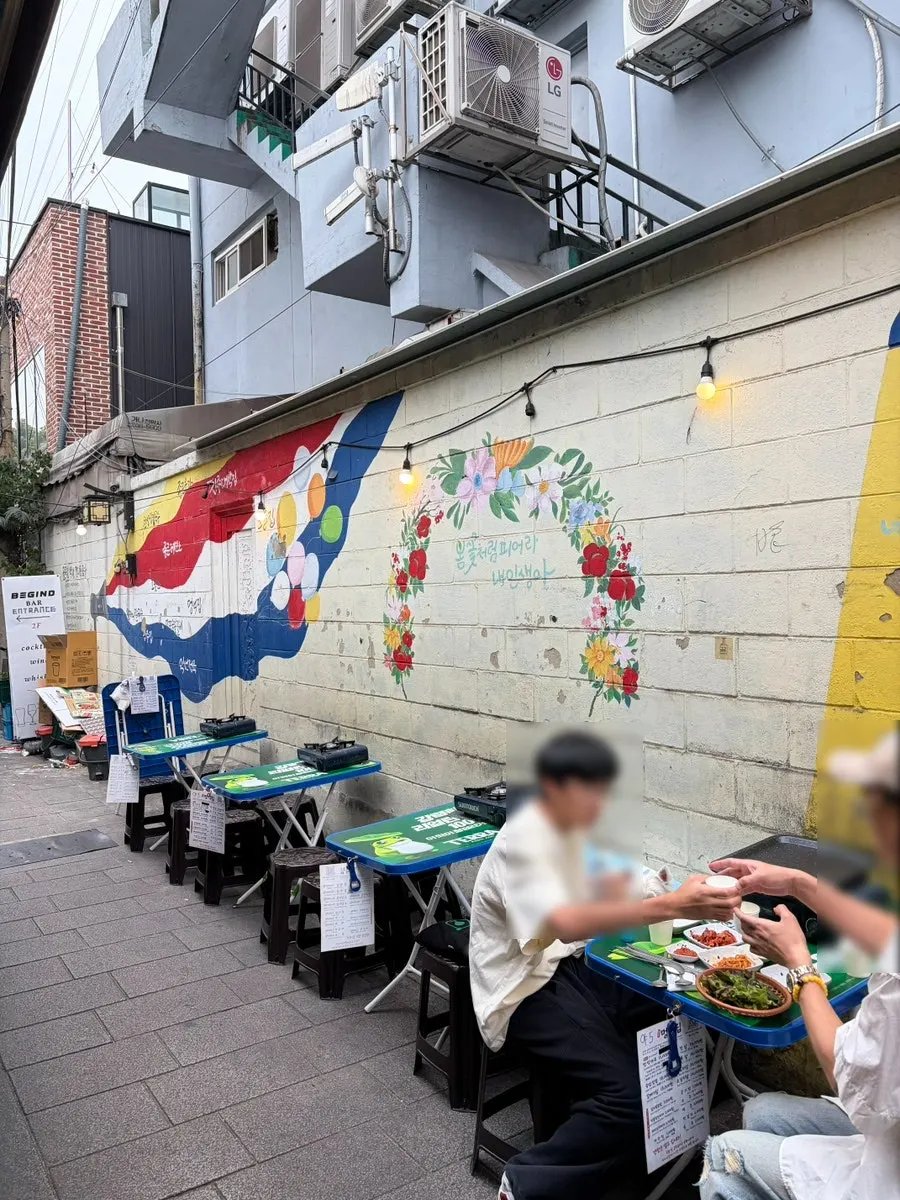 Patio table set up in front of Meongseokjip